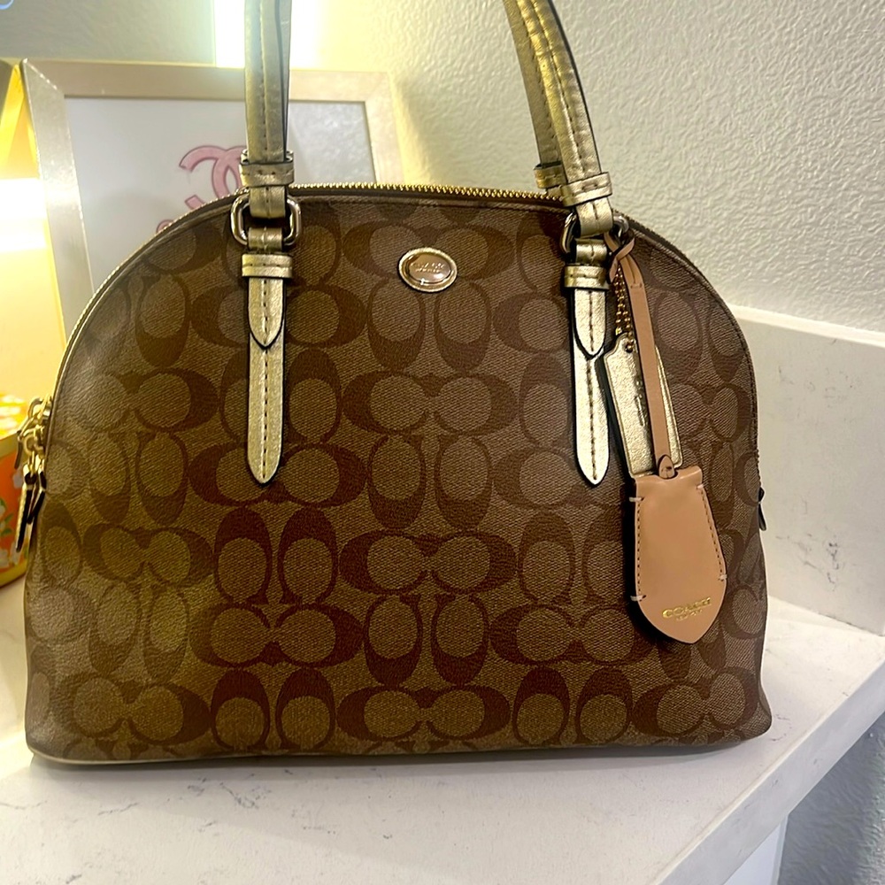 Coach Peyton Signature Cola Domed Satchel with hangtag.  Has some satins on back